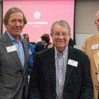 Dan DeVos, Happy Fox, and Larry Robson standing together and smiling for photo
